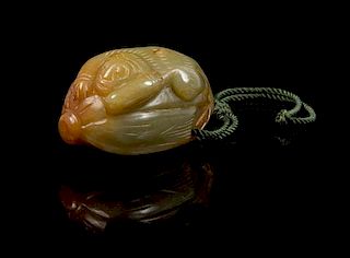 * A Carved Jade Toggle Length 2 inches.