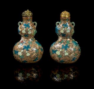 * A Pair of Polychrome and Gilt Enameled Porcelain Snuff Bottles LIKELY 18TH/19TH CENTURY Height 2 1/2 inches.