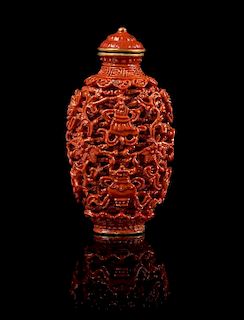 * A Red Glazed Porcelain Imitating Cinnabar Snuff Bottle Height 3 3/8 inches.