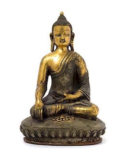 * A Sino-Tibetan Gilt Bronze Figure of Seated Buddha Height 5 3/4 inches.