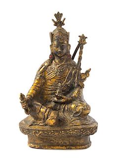 * A Tibetan Gilt Bronze Figure of a Deity Height 8 1/2 inches.