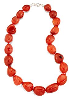 A CARNELIAN BEAD NECKLACE, the off-oval carnelian beads, be