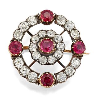 A 19TH CENTURY RUBY AND DIAMOND BROOCH, the round central r