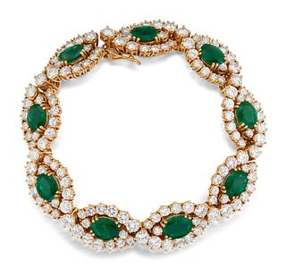 AN 18CT EMERALD AND DIAMOND BRACELET, the oval cut emeralds