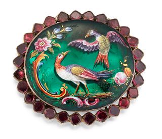 A 19TH CENTURY POLYCHROME ENAMEL AND GARNET CLASP, the oval