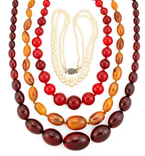 THREE FAUX AMBER NECKLACES AND A CULTURED PEARL NECKLACE, t