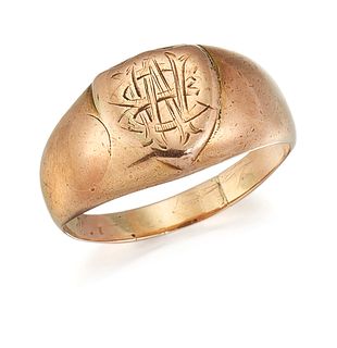 A SIGNET RING, the shield shaped signet ring with broad tap