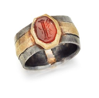 A FRENCH INTAGLIO RING, the oval carnelian intaglio, carved