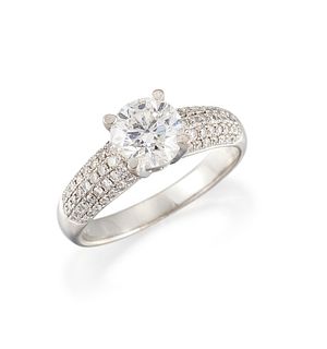 AN 18CT WHITE GOLD DIAMOND RING, the central round brillian