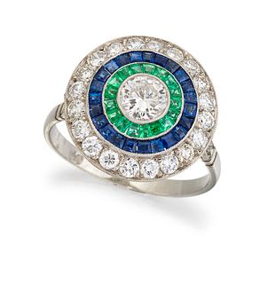 A PLATINUM DIAMOND, EMERALD AND SAPPHIRE TARGET RING, the c
