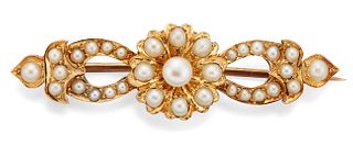 AN EDWARDIAN SEED PEARL BROOCH, the central seed pearl set 