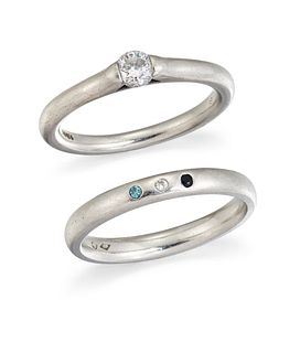 TWO PLATINUM AND DIAMOND RINGS, the first a diamond solitai