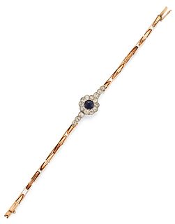 A SAPPHIRE AND DIAMOND BRACELET, the central round sapphire