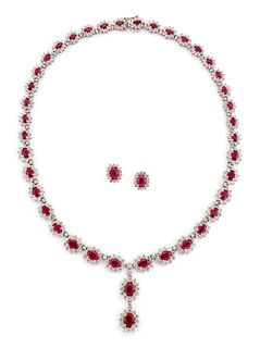 AN 18CT WHITE GOLD RUBY AND DIAMOND CLUSTER NECKLACE AND MA
