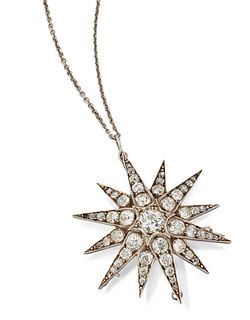 A VICTORIAN STAR BROOCH/PENDANT, the twelve pointed star se