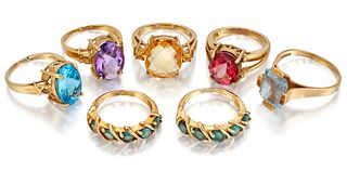 SEVEN 9 CARAT GOLD GEMSET RINGS, to include a pair of green