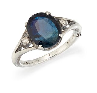 A SAPPHIRE AND DIAMOND RING, the oval sapphire, claw set wi