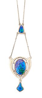 A SILVER AND ENAMEL PENDANT BY CHARLES HORNER, the central 