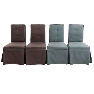 Lote de 4 sillas. Siglo XX. En talla de madera. Con respaldos capitonados y asientos en tapicería color verde y gris.