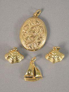 Four piece gold lot to include three gold charms, locket and coin, 14 and 18K gold, to include two gold charms in the form of oysters, with inner enam