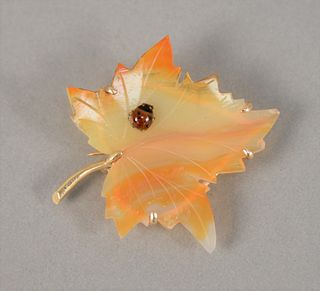 14K yellow gold leaf pin mounted with agate leaf  having ladybug.