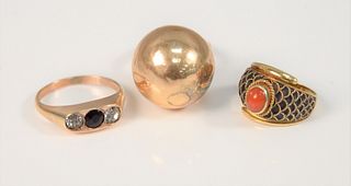 Three 14K gold rings to include one with fish scales and coral; one with three stones; one dome, 15.7 gr.