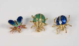Three 18K gold bugs to include one fly and two ladybugs, all with enameling, 10.4 gr.