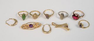Nine piece 10K gold lot to include pair of earrings, six rings, brooch, and pendant, total wt. 20.7 gr.