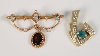 Two piece 14K lot to include brooch and pendant, brooch mounted with garnet and small opals, pendant mounted with emerald and diamonds, 10.6 gr.