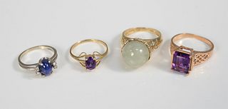 Four 14K gold rings, one with cabochon jadeite, two with amethyst along with one star sapphire, total wt. 16.4 gr.