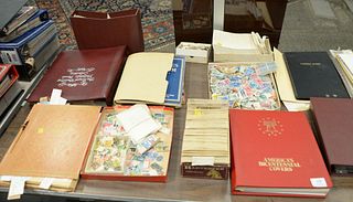 Large lot of stamp albums, loose and first day covers.