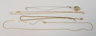 Group of four 14K gold necklaces along with a 14K ring, 18.7 grams, white gold 14", gold 19", 15" and 23 1/2".
