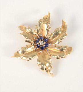 14k gold floral pin with blue stones and diamond, 10 gr. Provenance: Estate of Dr. Thomas & Alice Kugelman, Bloomfield, Connecticut.