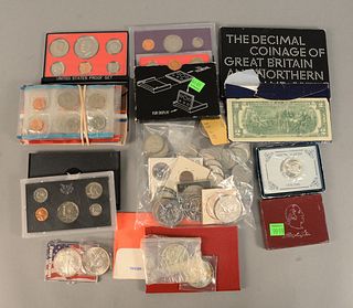 Mixed lot of U.S. coins to include 58 circulated Kennedy halves; 5 40% Kennedy halves; 2 silver dollars plus some foreign and 4 U.S. dollars along wit