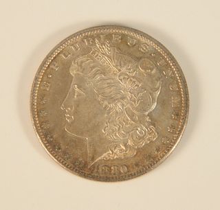 1880 S Morgan silver dollar, uncirculated.