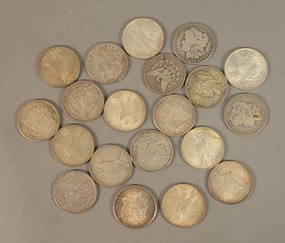 Twenty U.S. Morgan silver dollars.