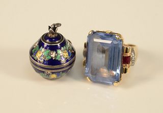 Two piece jewelry group to include 14K gold, ring having a large emerald cut blue topaz, the 14K gold mounting set with ruby and diamonds on each side