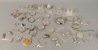 Large group of sterling silver jewelry to include bracelets, pins, pendants, etc., 44.8 t.oz. with stones.