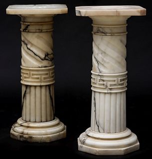 A PAIR OF STOUT 19TH CENTURY CARVED MARBLE PEDESTALS