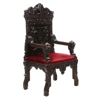 A HIGHLY CARVED 19TH CENTURY HERALDIC THRONE CHAIR