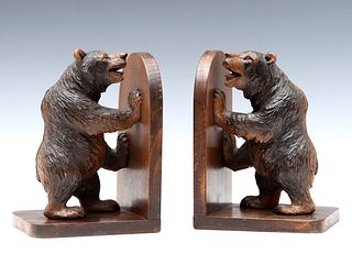 AN EARLY 20C BLACK FOREST CARVED WOOD BEAR BOOKEND PAIR