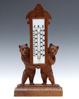BLACK FOREST CARVING OF BEARS PRESENTING A THERMOMETER