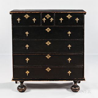 Black-painted Chest over Two Drawers, New England, early 18th century, with pintel-hinged top above a single arch-molded case of three