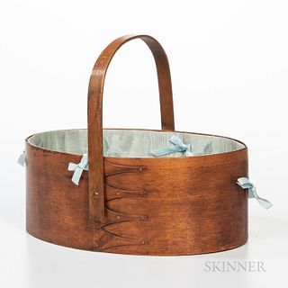 Shaker Oval Sewing Carrier, late 19th/early 20th century, with four swallow tails, lined in blue silk and with blue ribbons, (crack, re