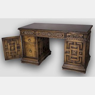 A Spanish Colonial Style Carved Oak Desk, 20th Century.