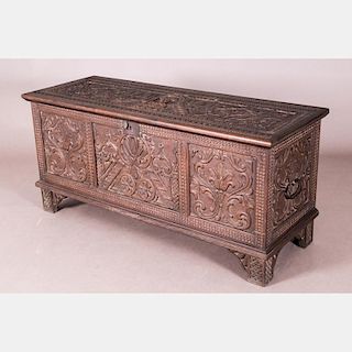 A Charles I Style Heavily Carved Walnut Chest, 19th/20th Century.
