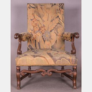 A Continental Carved Walnut Armchair with Tapestry Upholstery, 20th Century.