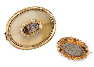 A 9CT HAIRWORK BROOCH AND A CHALCEDONY MEMORIAL BROOCH, the