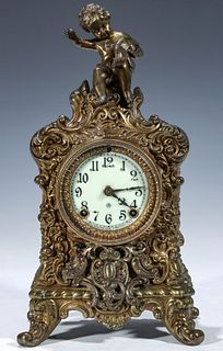 AN ANSONIA 'CREST' HIGHLY ORNATE CAST METAL CLOCK