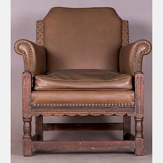 A Charles I Style Carved Oak Armchair with Vinyl Upholstery, 20th Century.